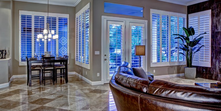 Fort Myers great room with classic shutters and modern lighting.
